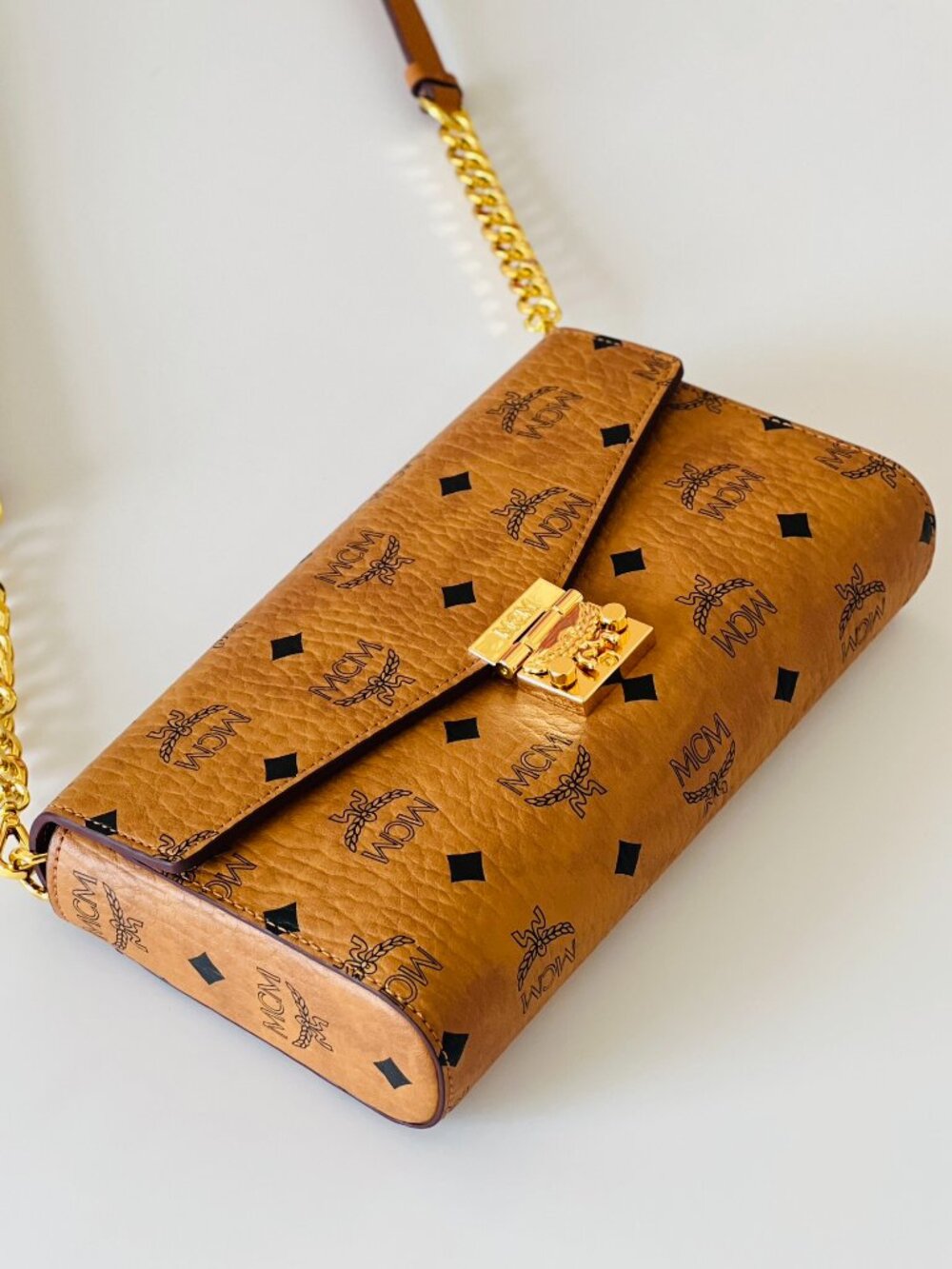 MCM Tan Monogram Clutch with Gold Accent - Picture 6 of 8